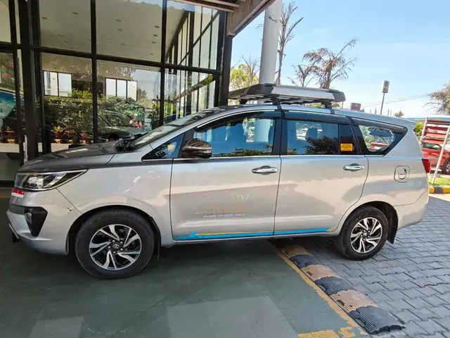 Silver Toyota Innova Crysta MUV, side view